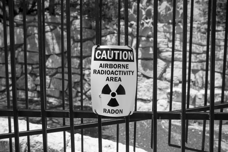 A black and white caution sign reading Airborne Radioactivity Area, Radon
